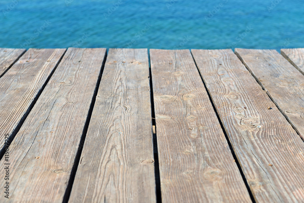 Empty top of wooden background and view to the sea Empty top of wooden background and view to the sea