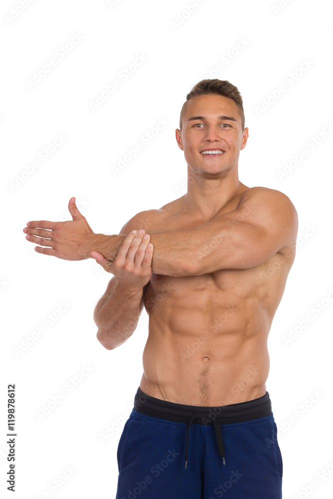 Smiling Fit Man Stretching Shoulders Smiling Fit Man Stretching Shoulders