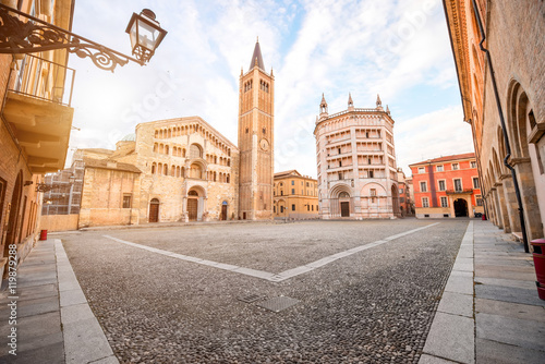 Parma cathedral with Baptistery leaning tower on the central square in Parma town in Italy photo
