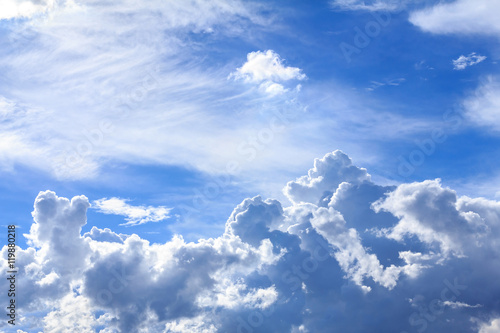 Blue sky with white clouds and rain clouds. The vast blue sky and clouds sky on sunny day. White fluffy clouds in the blue sky.