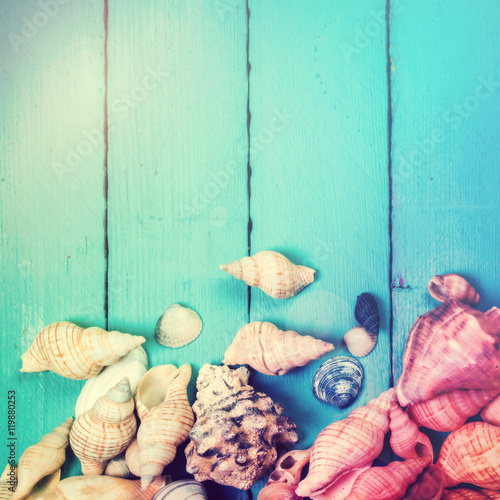 Canvas Print Concept of the summer time with sea shells on the wooden blue background