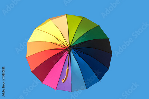 Rainbow umbrella isolated on sky