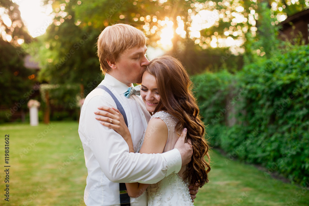 Fototapeta premium Sweet and lovely hugs of happy wedding couple