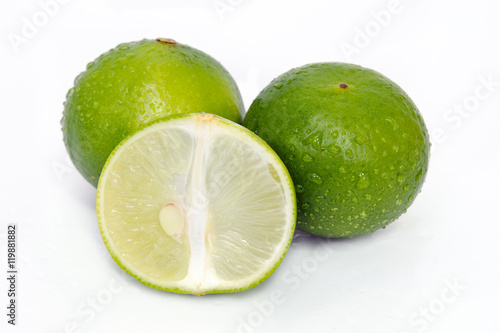 Lemon or lime fruit with half cross section and partial section