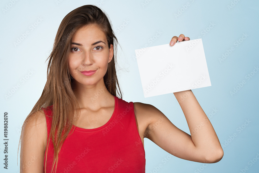 Smiling business woman handing a blank business card Smiling business woman handing a blank business card
