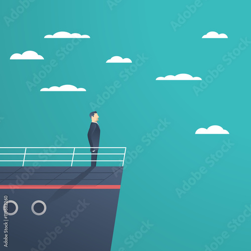Business man standing on a ship as  symbol of leadership, professionalism and strong, powerful manager.