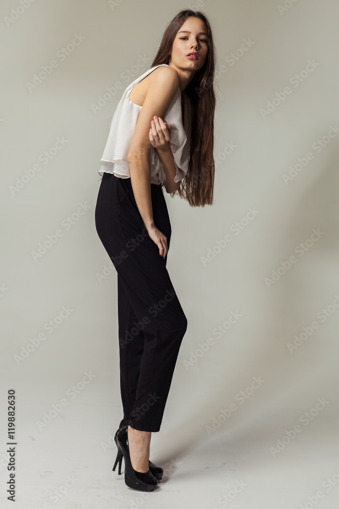 Full length portrait of a beautiful smiling woman posing isolated Full length portrait of a beautiful smiling woman posing isolated