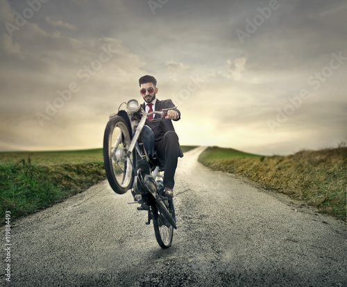Fototapeta Naklejka Na Ścianę i Meble -  Man riding a motorcycle in the countryide