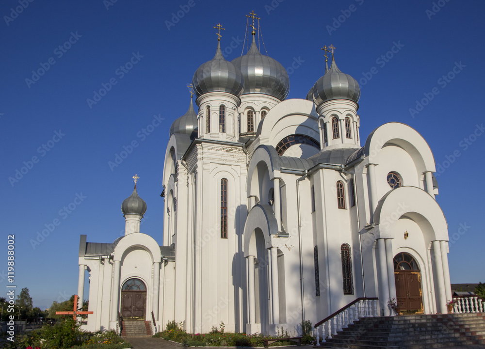 Orthodox Church with domes against the blue sky Orthodox Church with domes against the blue sky
