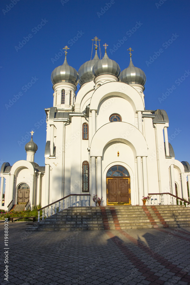Orthodox Church with domes against the blue sky Orthodox Church with domes against the blue sky