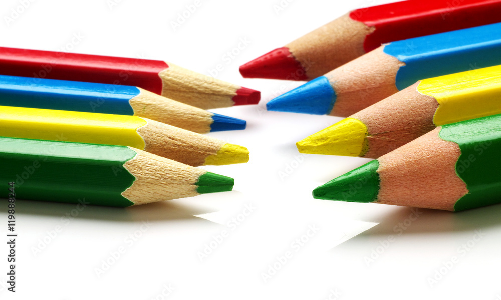 Set of big and small color pencils on white background, macro, shallow depth of field Set of big and small color pencils on white background, macro, shallow depth of field
