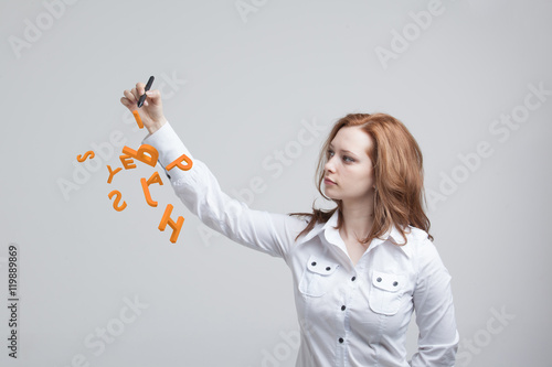 Woman working with a set of letters, writing concept.