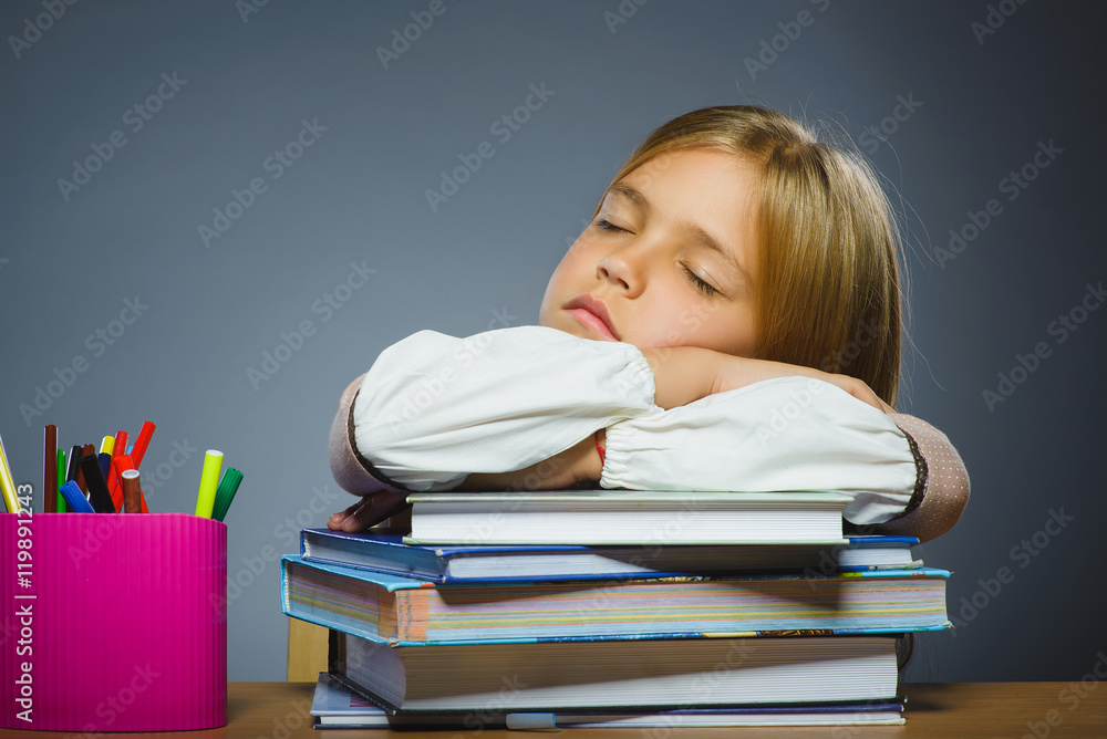 school concept. Closeup portrait girl asleep on pile of books school concept. Closeup portrait girl asleep on pile of books