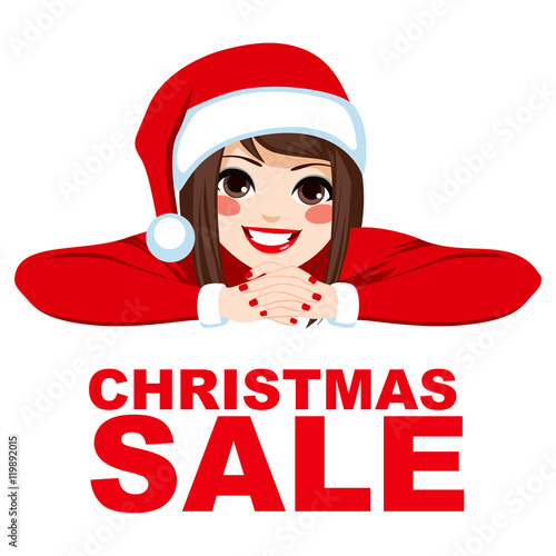 Woman wearing Santa hat smi...
