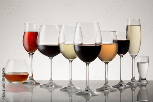 Collection of stemware with drinks.