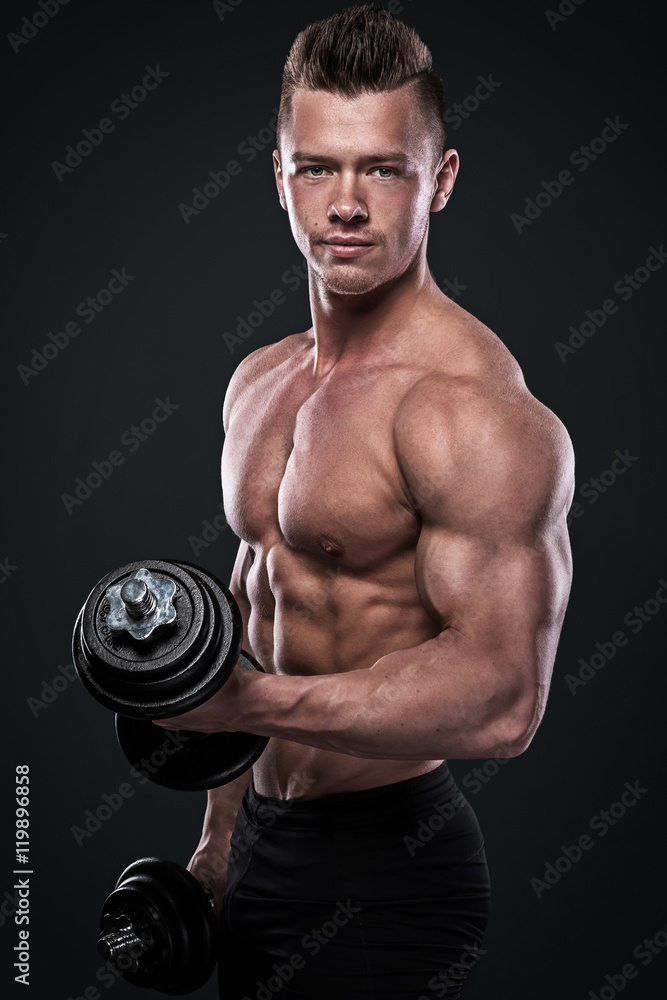 Bodybuilder doing exercises with dumbbells