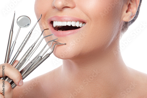 Obraz na płótnie Smiling woman and dental tools