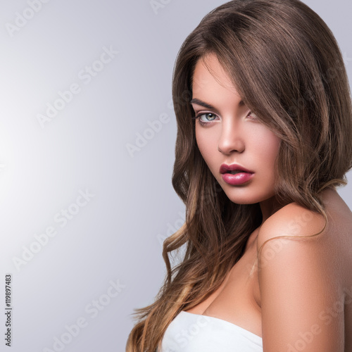 Portrait of young woman with curly hair