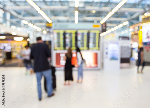 passenger look at the boarding time in airport with blur motion