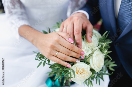 Happy bride and groom on their wedding hugging