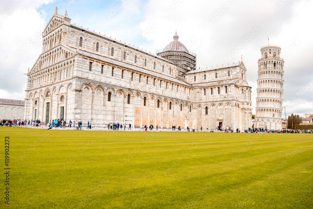 Pisa cathedral with baptistery and leaning tower on the field of Miracles in Pisa town in Italy