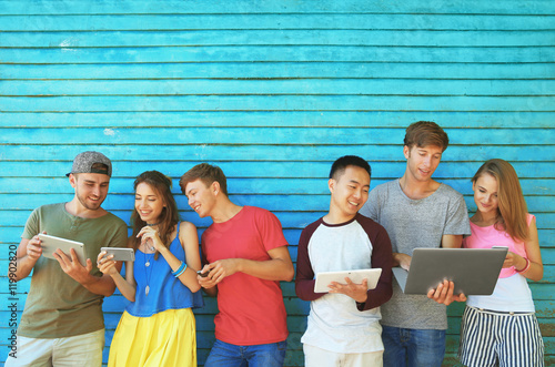 Young people with gadgets o...