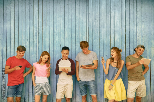 Young people with gadgets o...