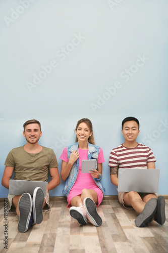 Young people with gadgets h...