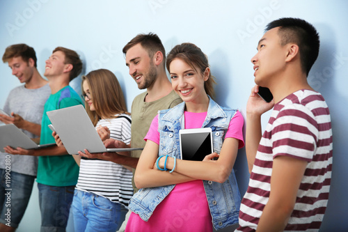 Young people with gadgets h...