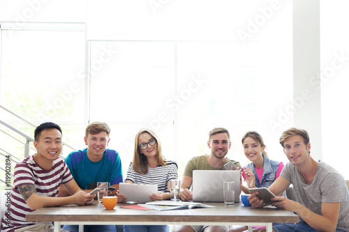 Young people with gadgets h...