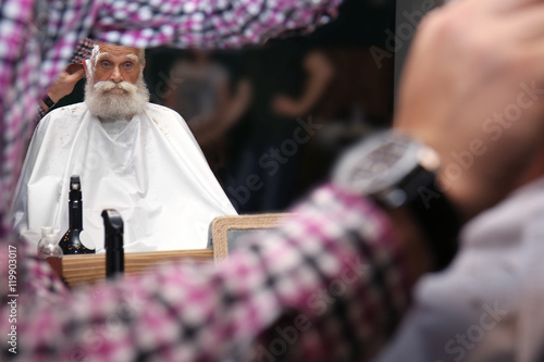 Elderly bearded man at barb...
