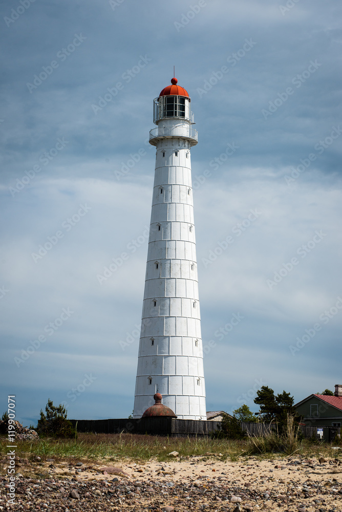 lighthouse with rusty metal rails near sea port lighthouse with rusty metal rails near sea port
