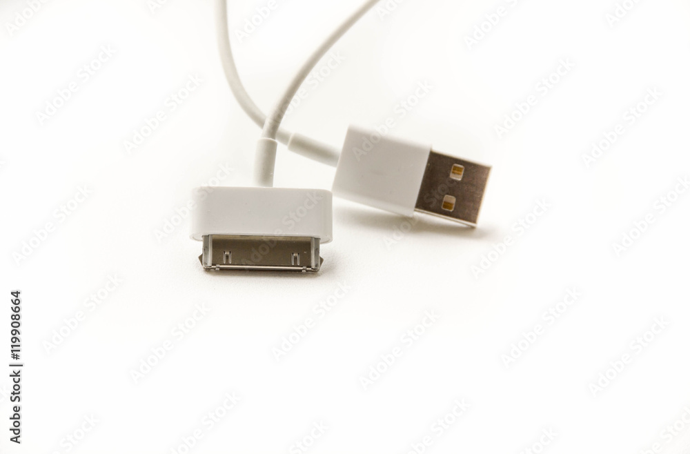 White wire usb mobile charging cable. 2 different cellphone charging plugs adapter from USB isolated on white background White wire usb mobile charging cable. 2 different cellphone charging plugs adapter from USB isolated on white background