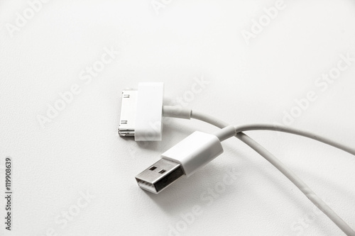 White wire usb mobile charging cable. 2 different cellphone charging plugs adapter from USB isolated on white background