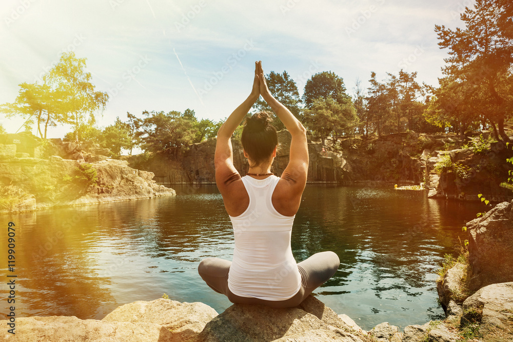 Young woman doing yoga in morning