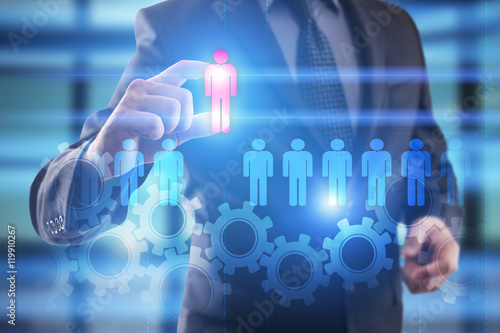 Businessman select people icon on virtual screen. HR management concept. 