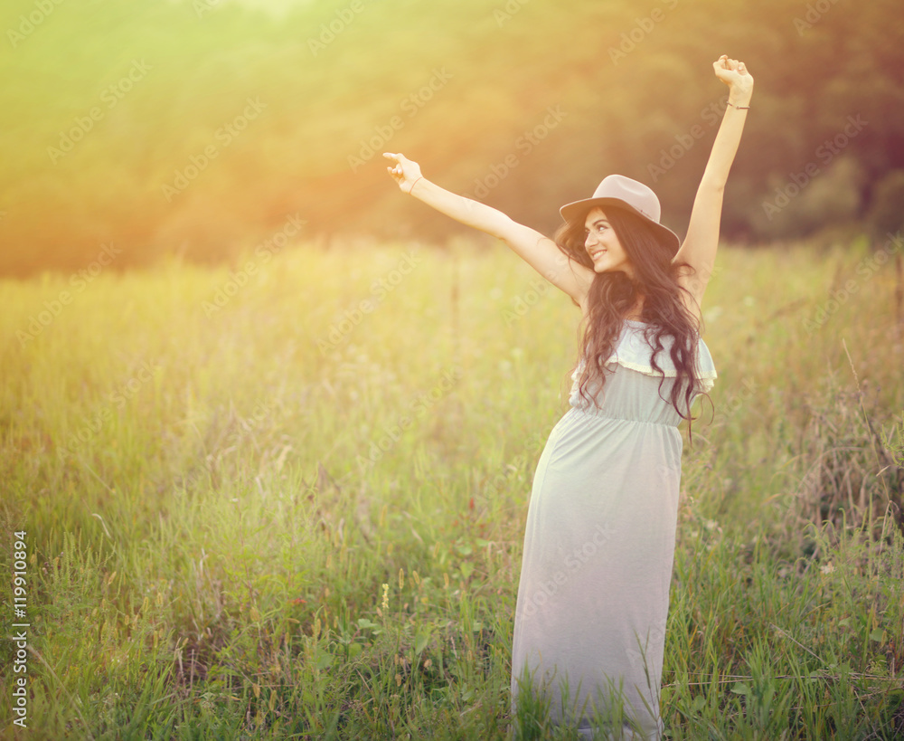 Girl enjoying nature on the field on a beautiful summer day Girl enjoying nature on the field on a beautiful summer day