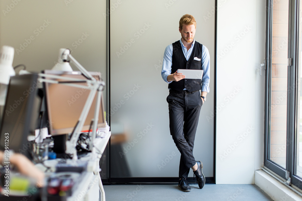 Man with tablet in office Man with tablet in office