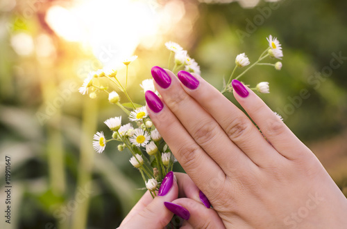 Closeup, woman hand beautiful pink nails, outdoors, nails beauty © phoenix021