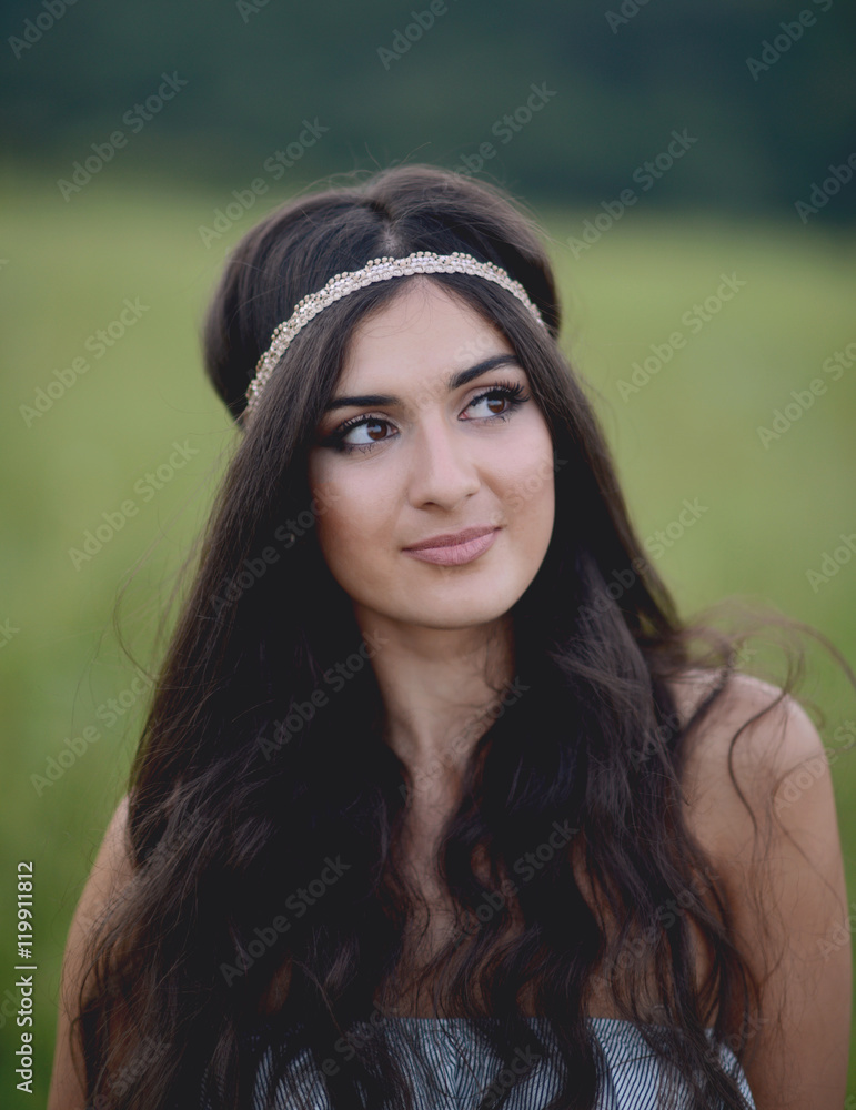 Fototapeta premium Portrait of beautiful young woman in nature