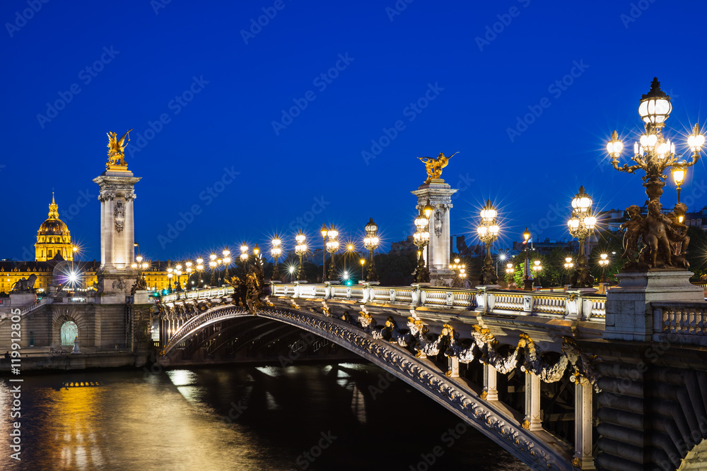 Pont Alexandre III bridge over river Seine with beautiful night