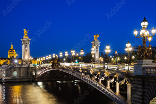 Pont Alexandre III bridge over river Seine with beautiful night