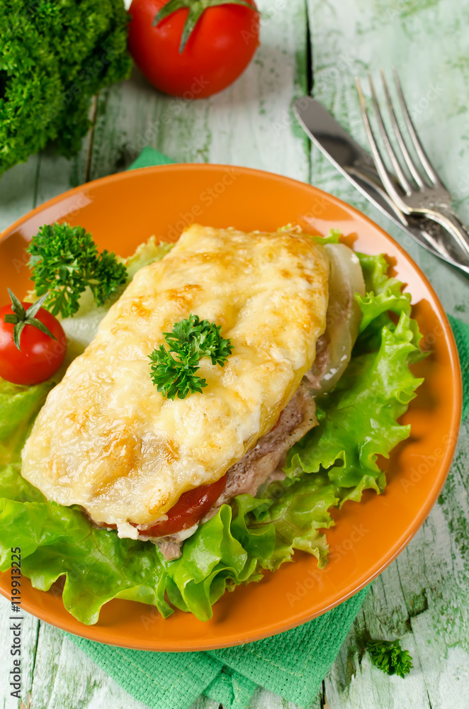 Pork chop with tomatoes, potatoes and cheese Pork chop with tomatoes, potatoes and cheese