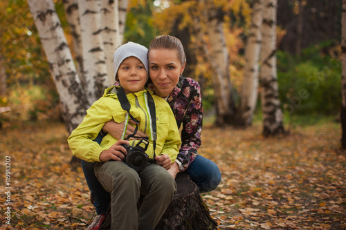 Woman and her son with camera
