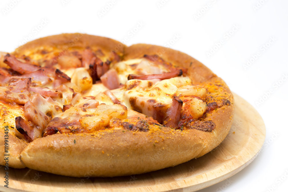 Hawaiian pizza on a wooden tray. Hawaiian pizza on a wooden tray.