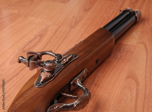 Vintage pistols on wooden background