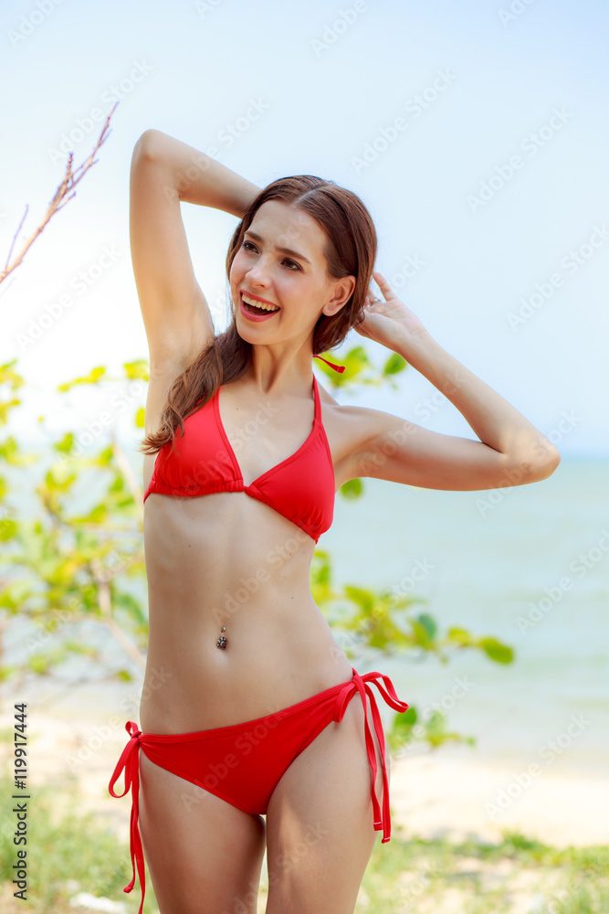 Beautiful women, bikinis, sea red background. Stock Photo | Adobe Stock