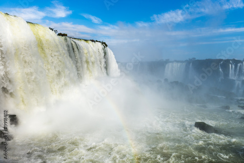 The Iguazu Falls with clouds and blue sky