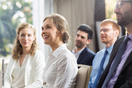 Smiling audience watching presentation