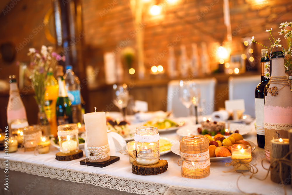 Beautiful decorated wedding table. candles on the table during the evening wedding dinner
Beautiful decorated wedding table. candles on the table during the evening wedding dinner